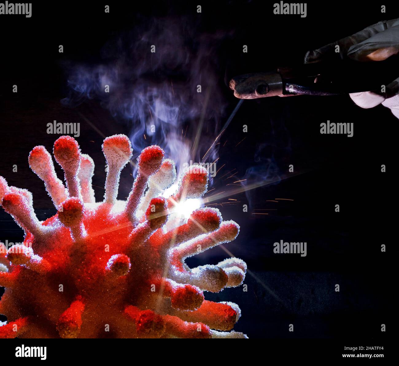 symbolic scenery showing genetic engineering of a symbolic virus in dark back Stock Photo