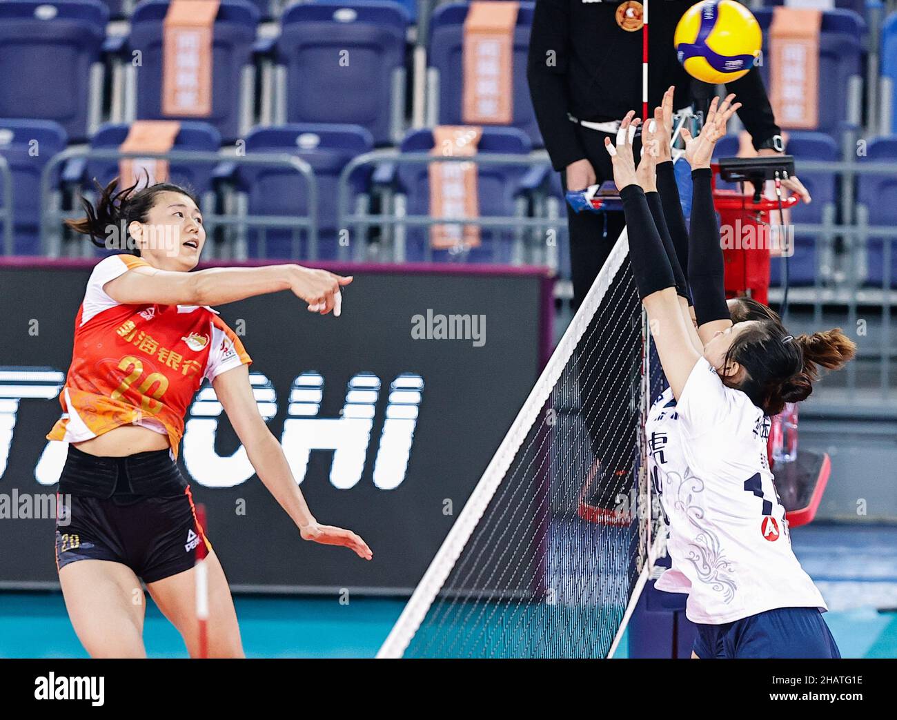 Jiangmen, China's Guangdong Province. 15th Dec, 2021. Wang Yizhu (L) of Tianjin spikes the ball during the Group C match between Tianjin and Shenzhen at the second stage of the 2021-2022 season Chinese Women's Volleyball Super League in Jiangmen, south China's Guangdong Province, Dec. 15, 2021. Credit: Yang Zhisen/Xinhua/Alamy Live News Stock Photo