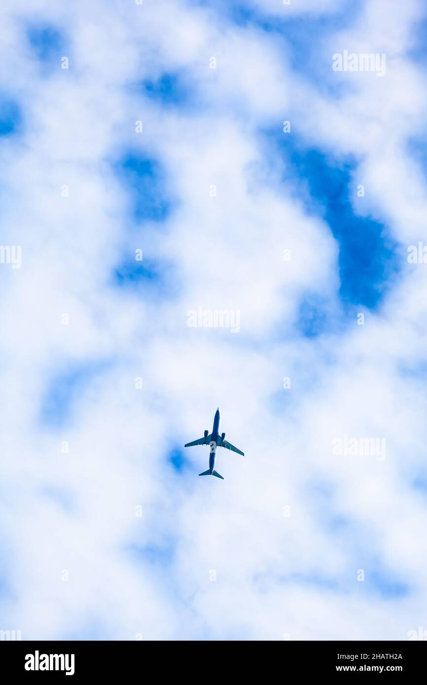 Airplane fly above high up on sky (copy space) Stock Photo