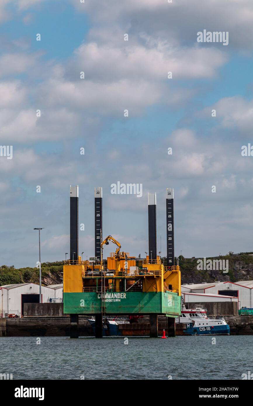 A crane barge, The Jub Commander of Bridgetown, is docked at Deadman's Bay near Plymouth, Devon, UK Stock Photo