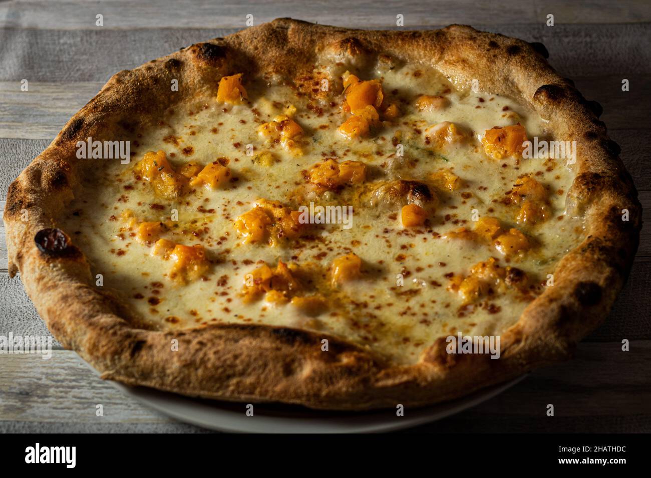 stuffed pizza on wooden background Stock Photo