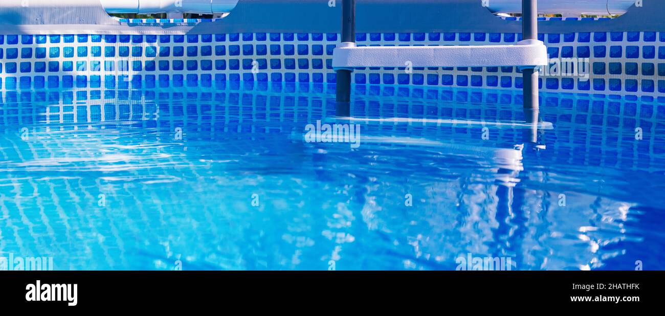 Banner. Plastic white staircase in prefabricated pool.  Stock Photo