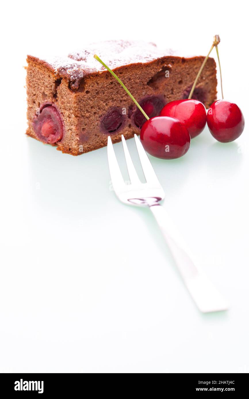Cherry cake, piece of cake, icing sugar, cherries, cake, chocolate cake, piece, fork, fruit, fruit cake, white, background, cherry, full, genuine, rea Stock Photo