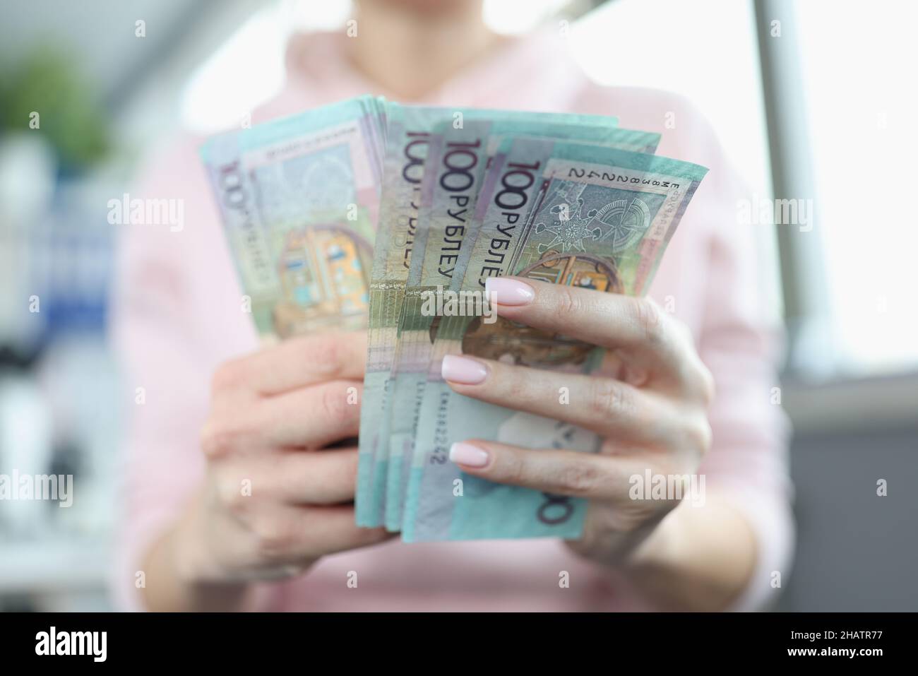 Female hands counting lot of belarusian banknotes closeup Stock Photo