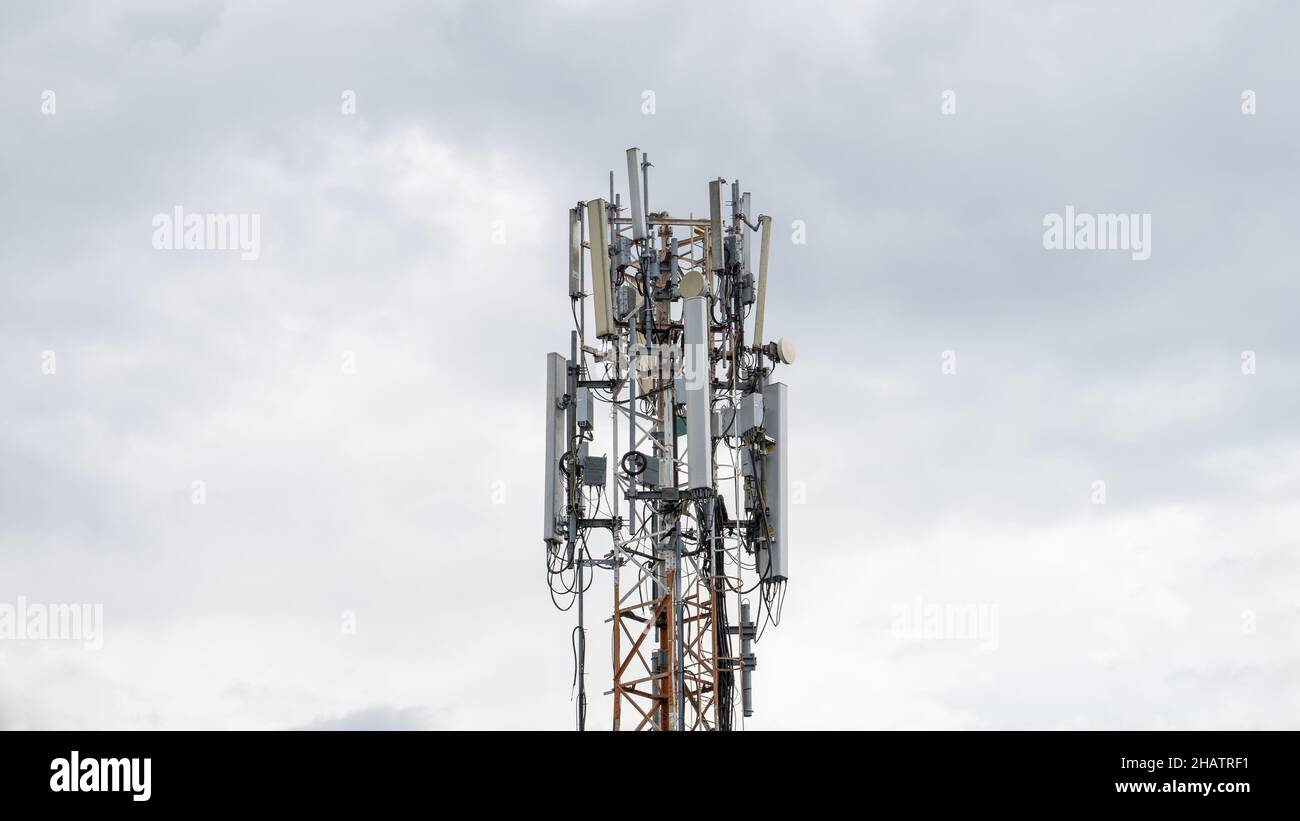5G radio network telecommunication equipment with radio modules and smart antennas mounted on a building Stock Photo