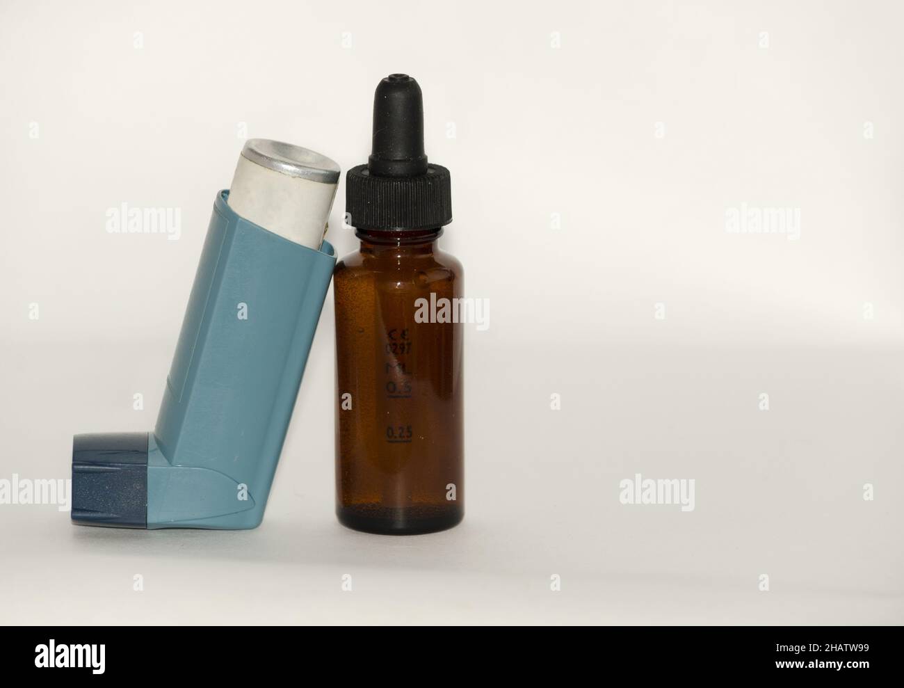 Small bottle of salbutamol with an inhaler on the white surface Stock ...