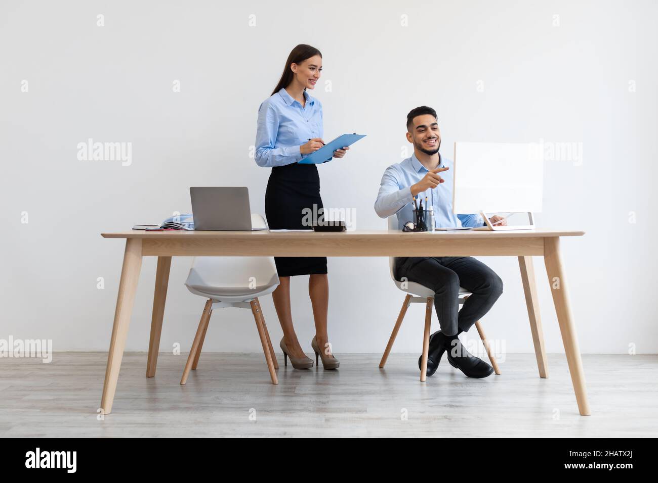 Portrait Of Smiling Colleagues Working At Office Together Stock Photo
