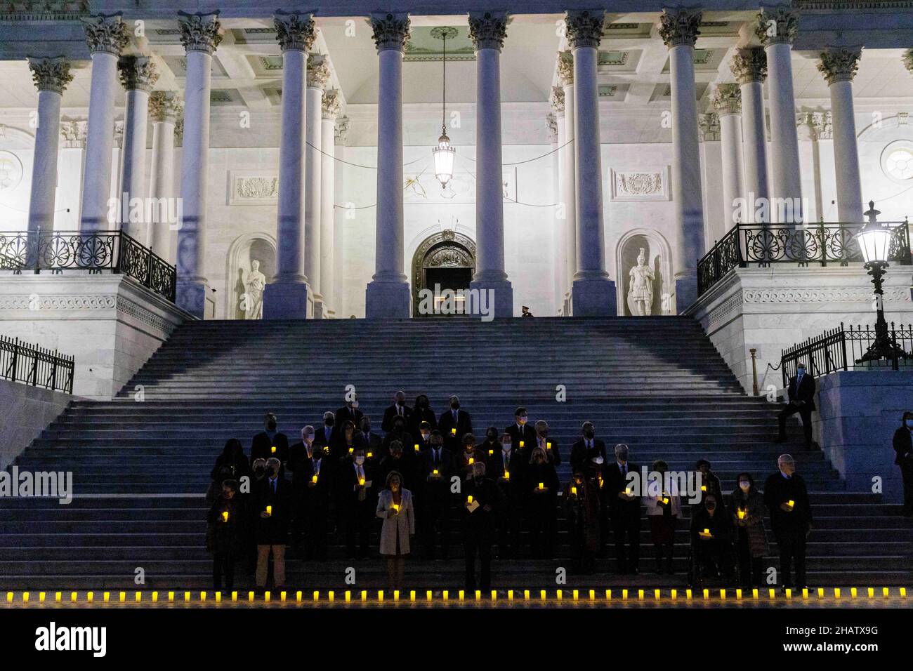 Washington, DC, USA. 14th Dec, 2021. A Moment of Silence for 800,000 American Lives Lost to COVID-19 is held at the Capitol in Washington, DC, the United States on Dec. 14, 2021. Credit: Ting Shen/Xinhua/Alamy Live News Stock Photo