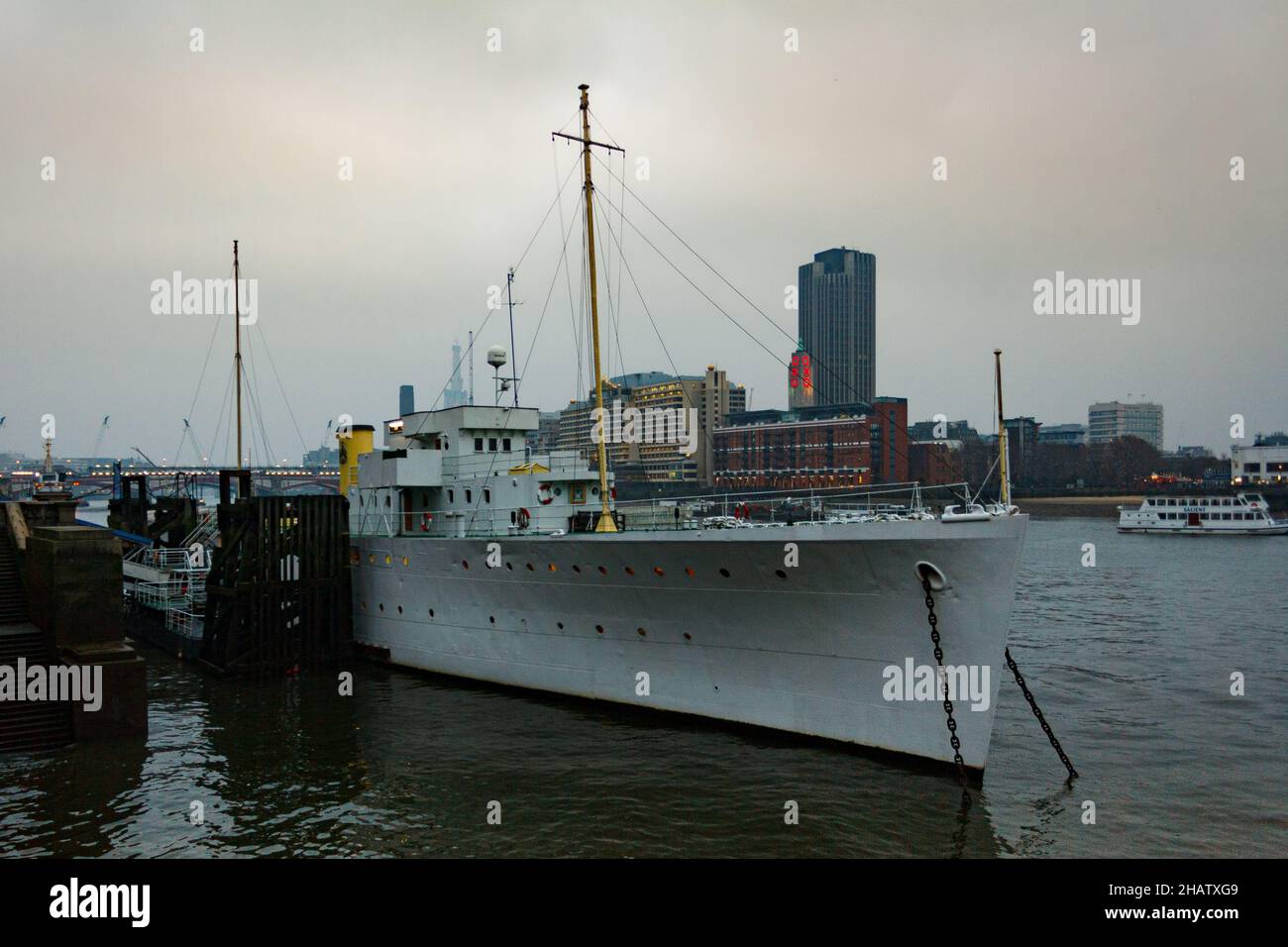 London, United Kingdom; March 16th 2011: Museum ship, HQS Wellington, docked at a Thames quay. Stock Photo