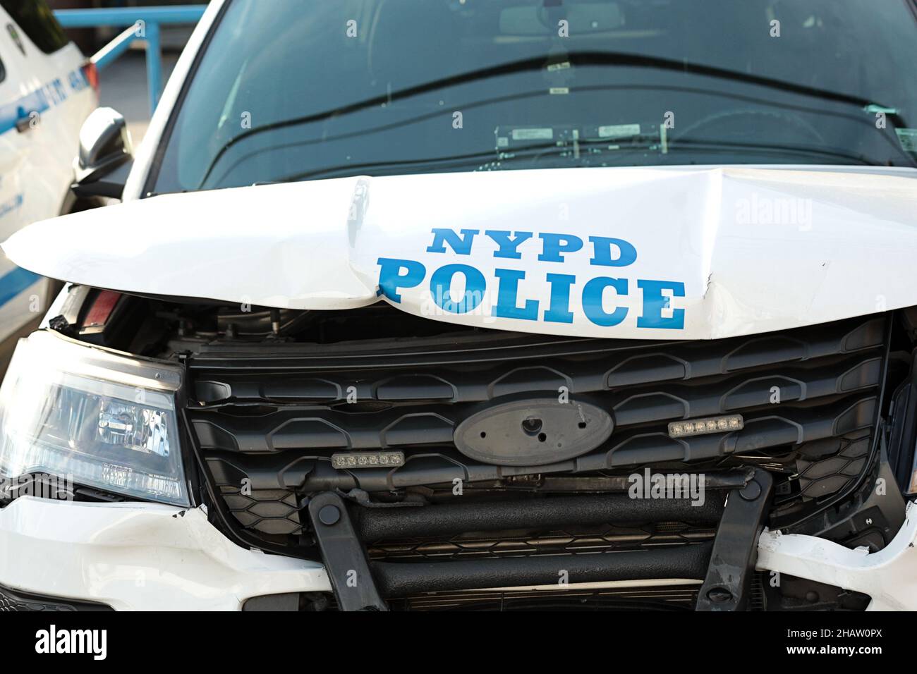 New York, NY - October 2, 2021: Crashed NYPD patrol car with police logo on dented hood and smashed grill. Stock Photo