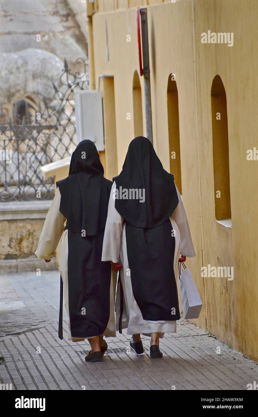 Two nuns go shopping, prayer sisters after shopping, nuns in robe with
