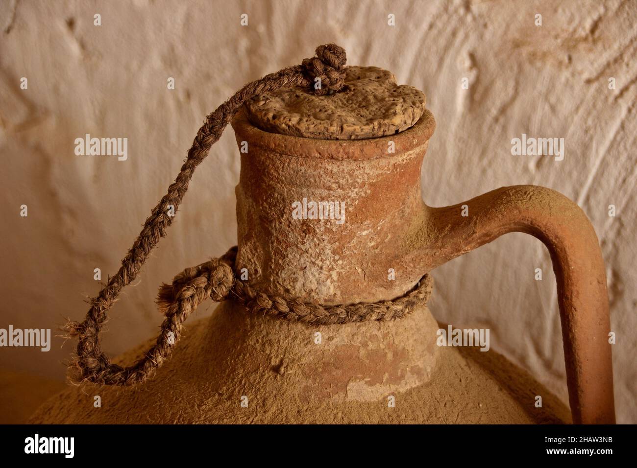 Clay water jug and cork stopper, with cord of esparto grass, Andalusia