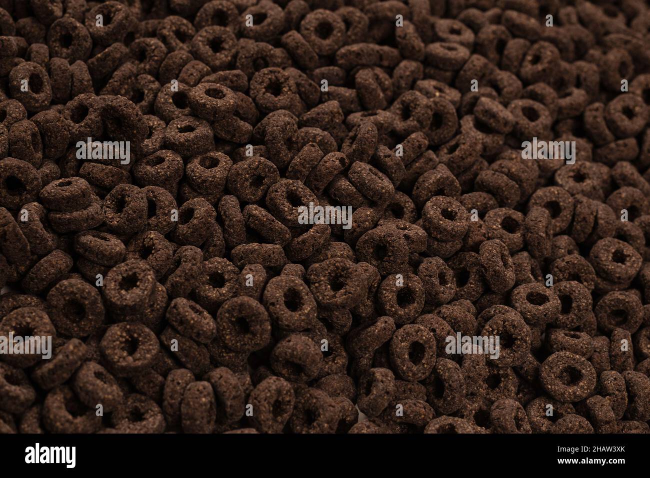 Corn-flakes background and texture. Chocolate rings. Stock Photo