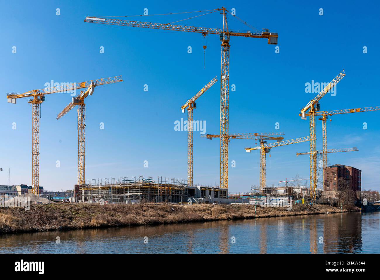 Construction cranes at the Europacity developing area on Berlin's Landwehrkanal, Berlin, Germany Stock Photo