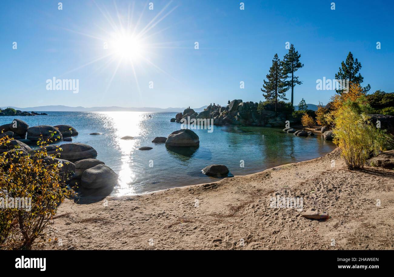 Sand beach and round stones in the water, bay at Lake Tahoe, Sand