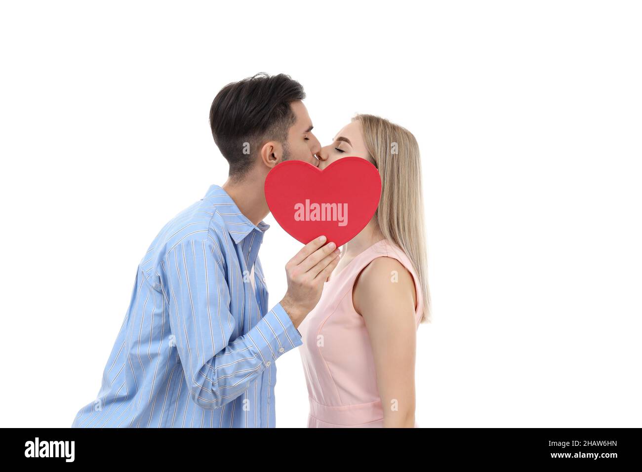 Cute couple with heart isolated on white background Stock Photo - Alamy