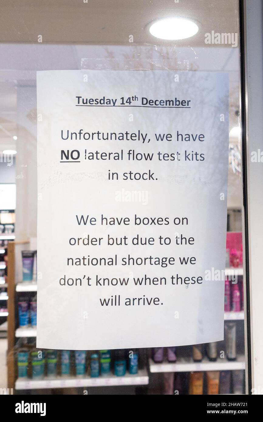 Milngavie, East Dunbartonshire, Scotland, UK. 15th Dec, 2021. 'no lateral flow test kits in stock . . . '  sign on the door of Boots chemist as people struggle to obtain test kits Credit: Kay Roxby/Alamy Live News Stock Photo