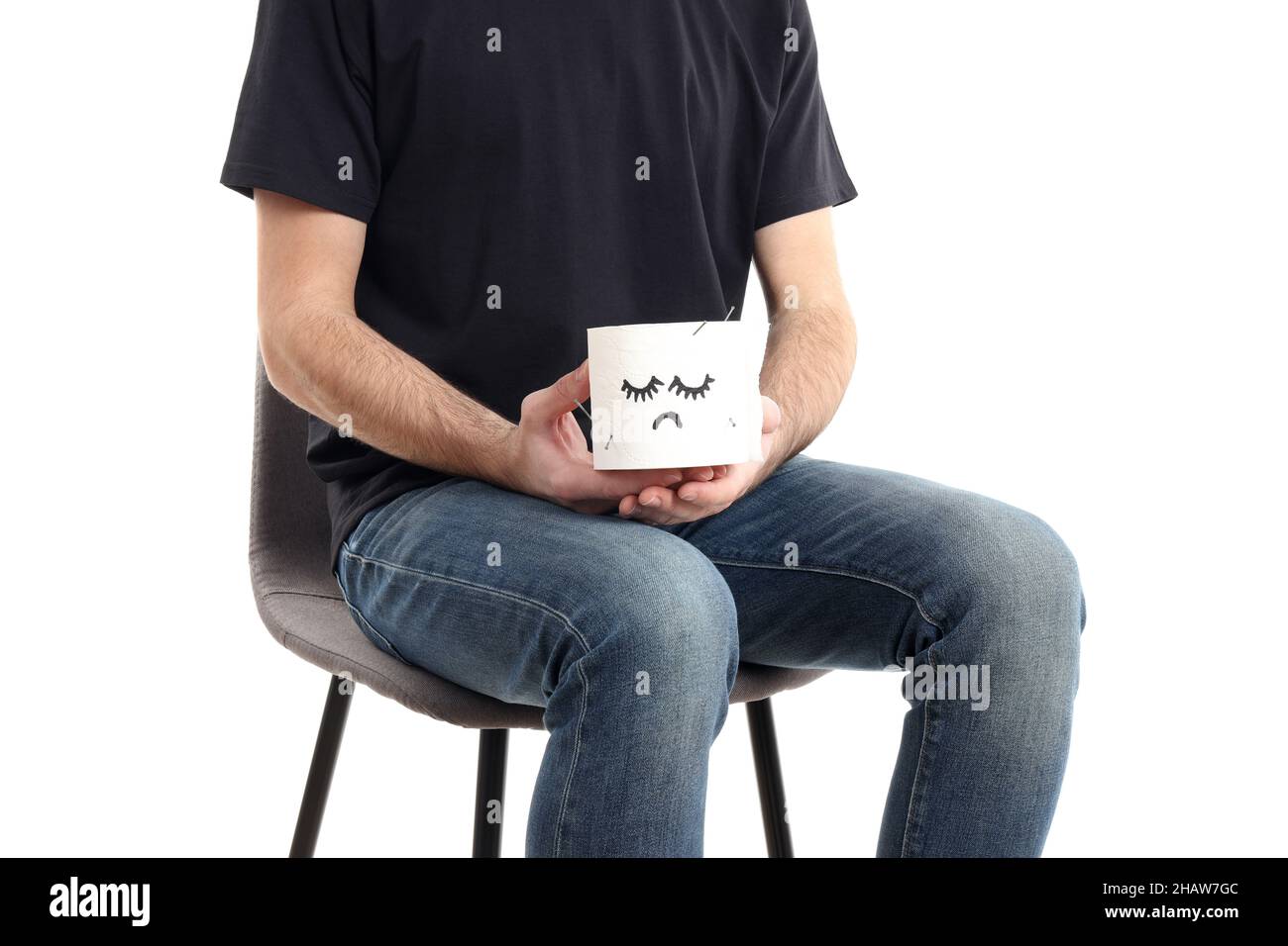 Man sitting on chair, isolated on white background. Hemorrhoids concept
