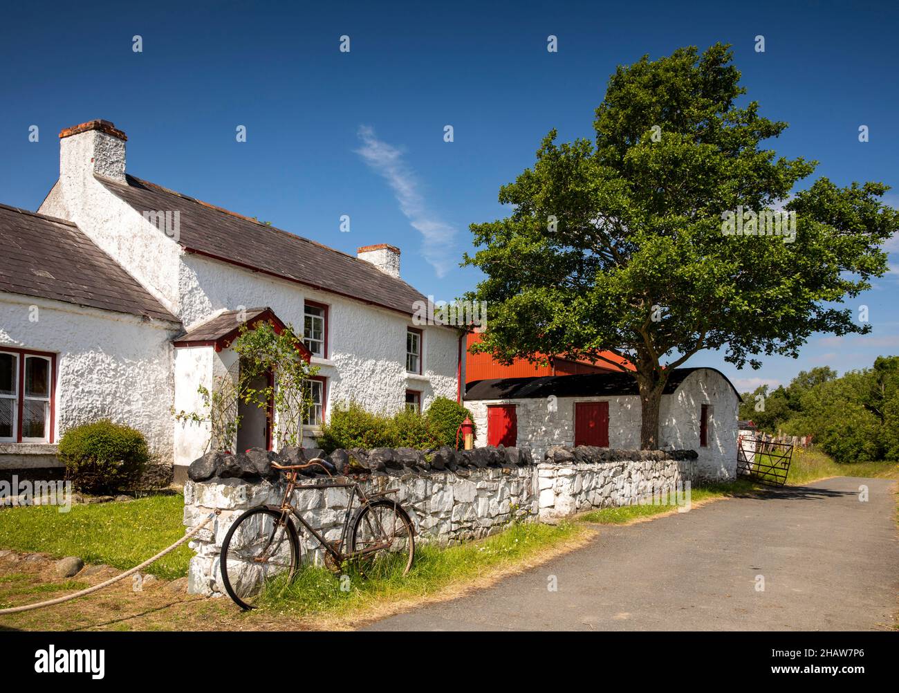 UK Northern Ireland, Co Down, Holywood, Ulster Folk Museum, bicycle outside Drumnahunshn Farm Stock Photo