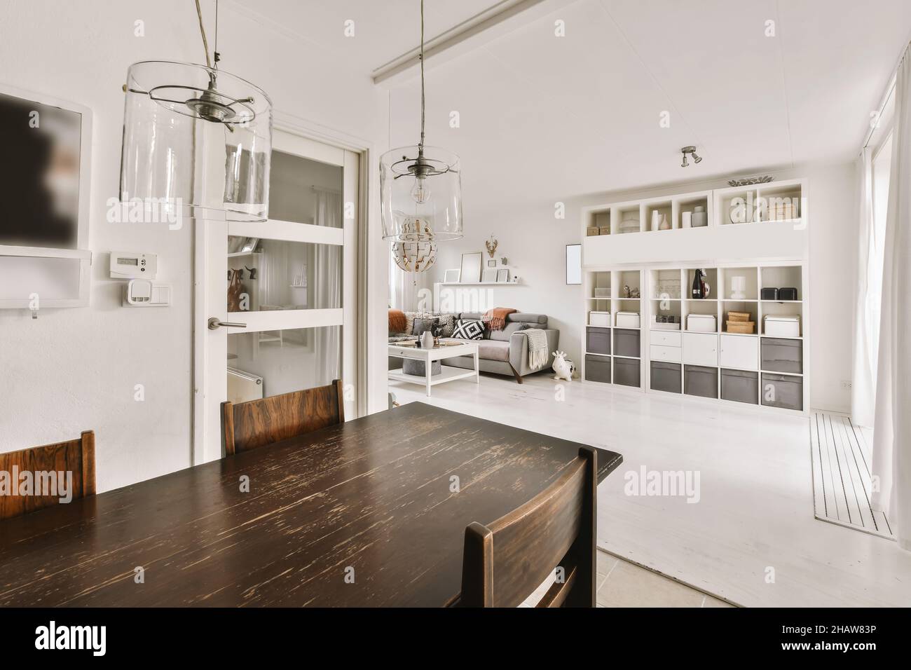 Delightful dining room with dark wood table and chairs Stock Photo - Alamy
