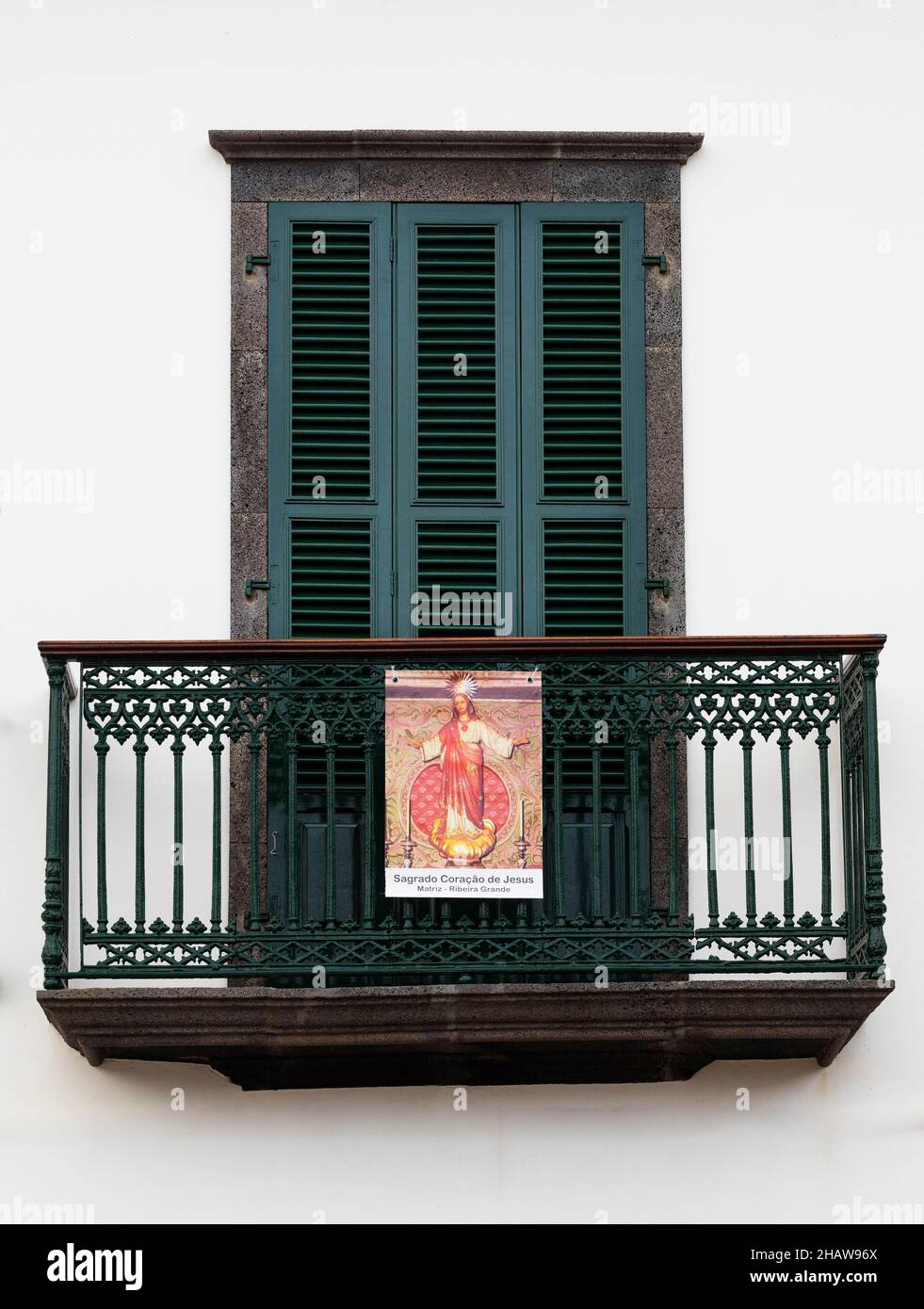 House facade with balcony and image of a saint, Ribeira Grande, Sao Miguel Island, Azores, Portugal Stock Photo