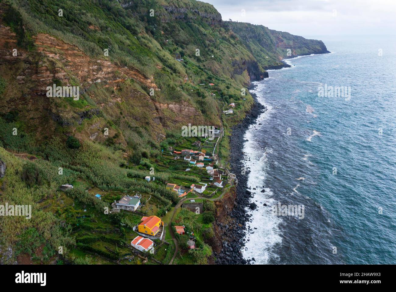 View of the cliff and settlement of Rocha da Relva, Sao Miguel Island, Azores, Portugal Stock Photo