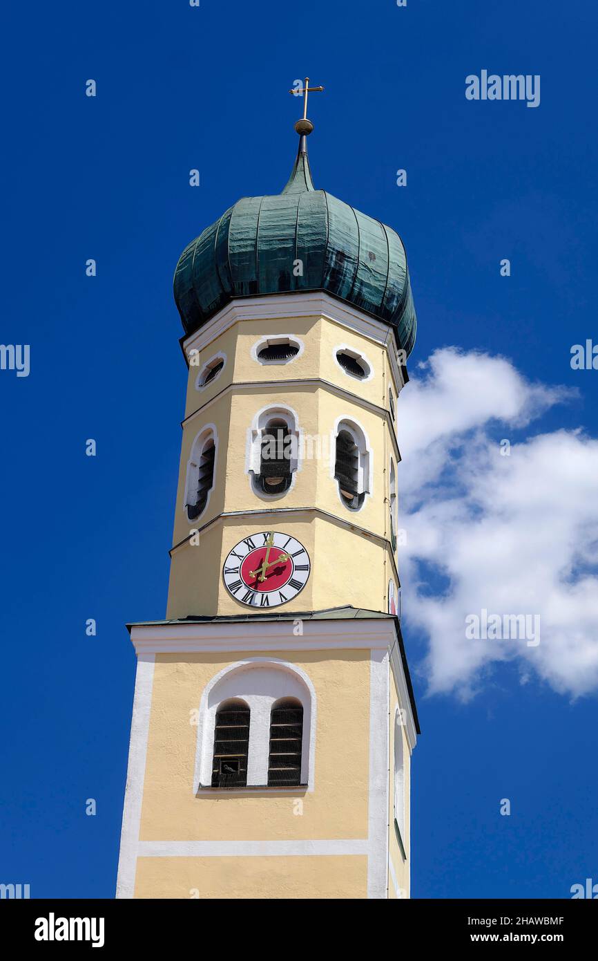 Onion dome of an Upper Bavarian church against a white blue sky