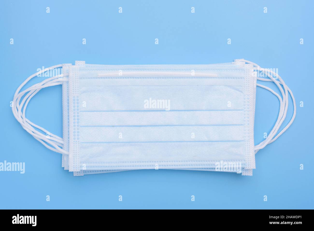 Surgical masks pack on soft blue background,flat lay Stock Photo Alamy