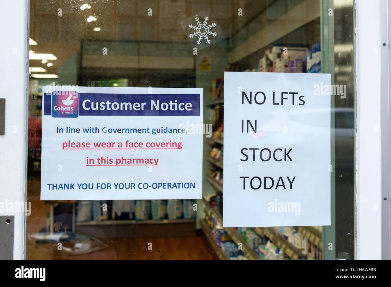 Sign in pharmacy window saying No LFT's in Stock today. No Lateral flow Tests Stock Photo