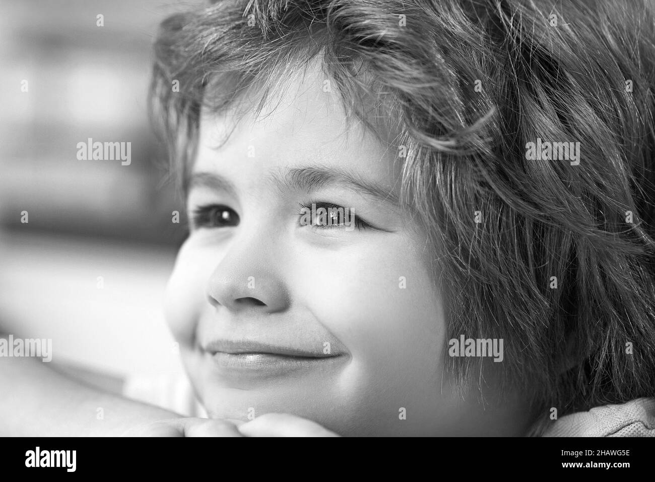Beautiful little child with red hair smiling close up portrait. Stock Photo