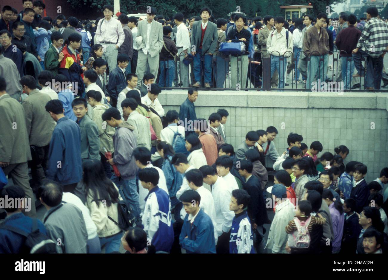 crowd of people at a metro station in the city center of Beijing in China.  China, Beijing, October, 1997 Stock Photo