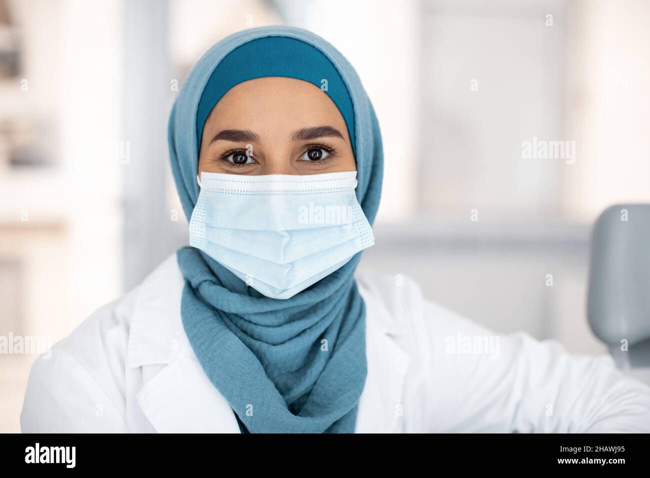 Portrait Of Muslim Female Medical Worker In Hijab And Protective Face