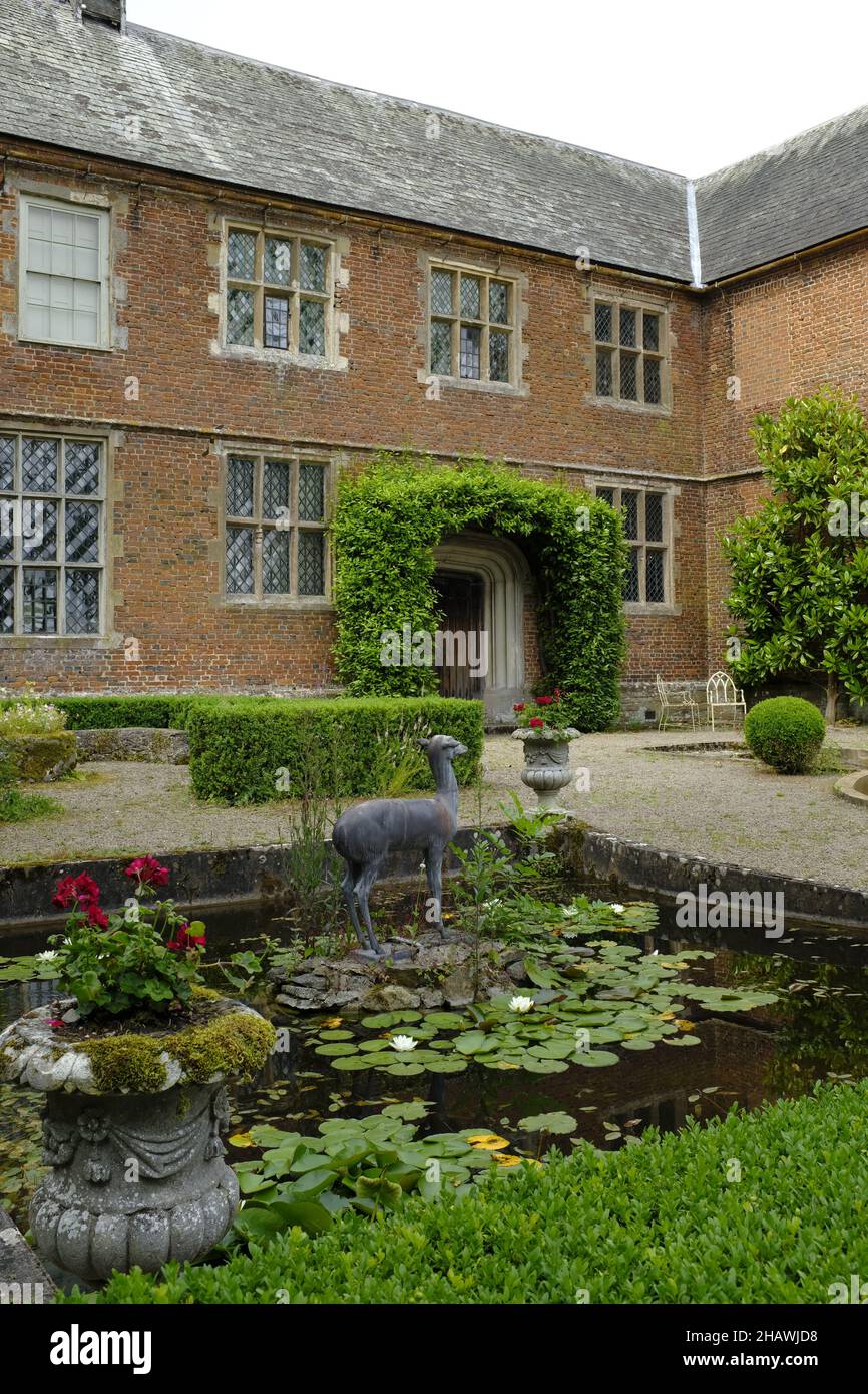 Sculpture of a fawn in a lily pond in the garden in front of Hellens House, Much Markle, Herts. UK Stock Photo