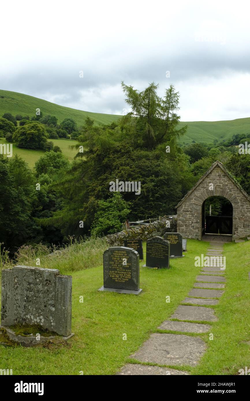St. Issui's Church graveyard and covered gate in a hilly landscape, Partrishow, Powys, Wales,  UK Stock Photo