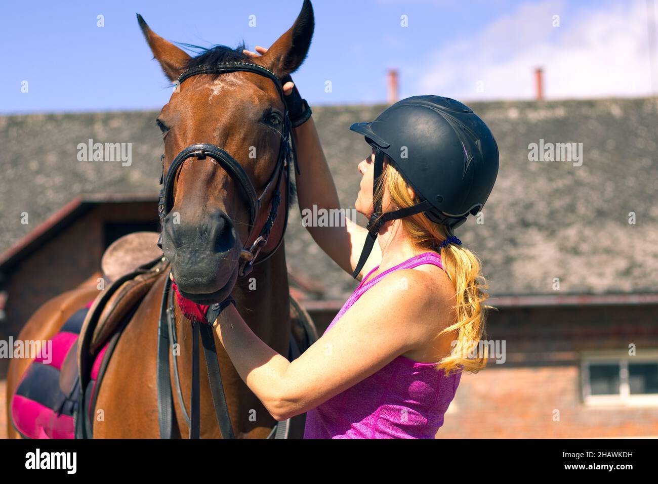 Blonde woman riding horse hi-res stock photography and images - Alamy