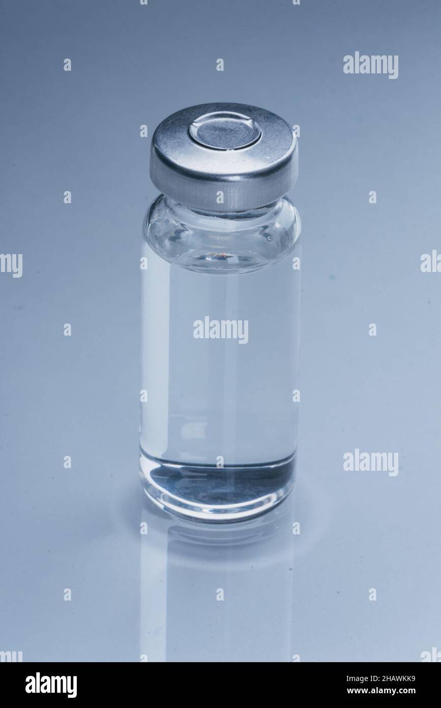 Glass medical ampoule vial for injection. Medicine is dry white drug ...