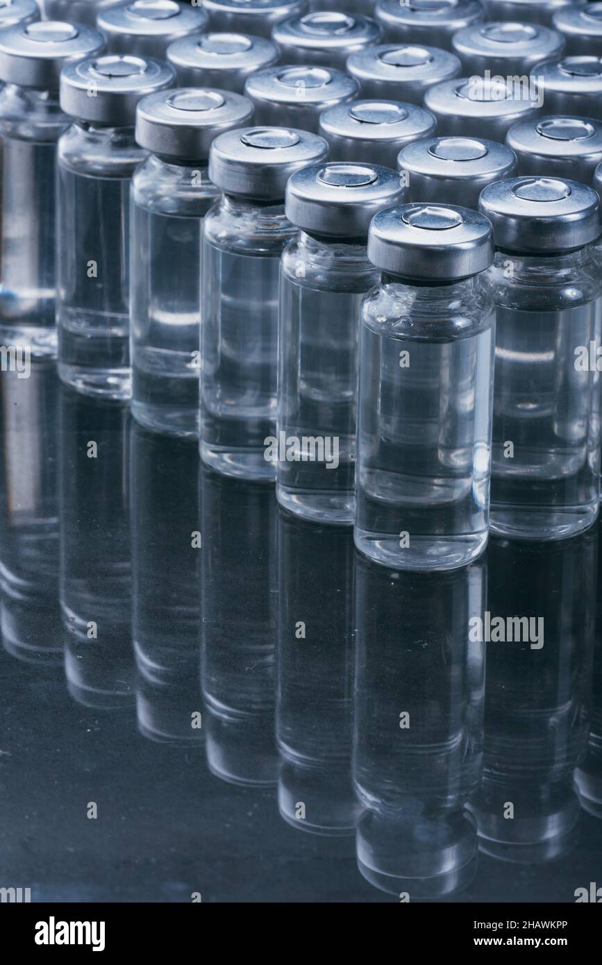 Glass medical ampoule vial for injection. Medicine is dry white drug ...