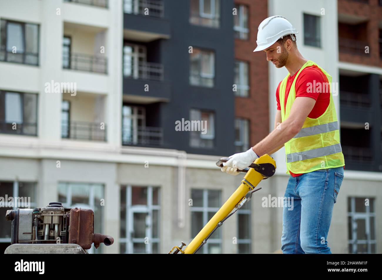 Profile of man with construction equipment Stock Photo