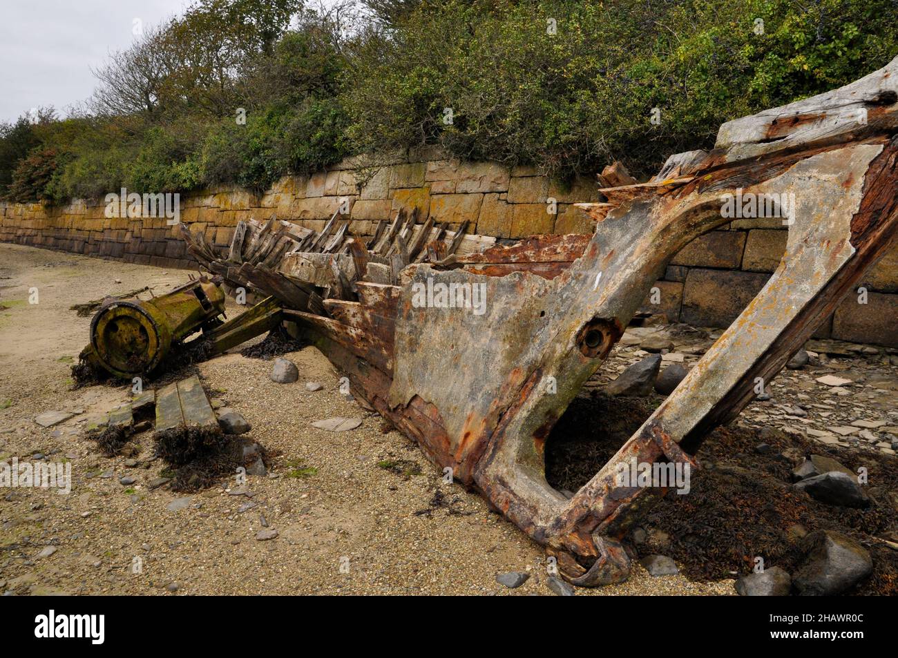 Remains of a wrecked wooden boat on the foreshore in the tidal estuary of the river Hayle nr St.Ives in Cornwall, UK Stock Photo