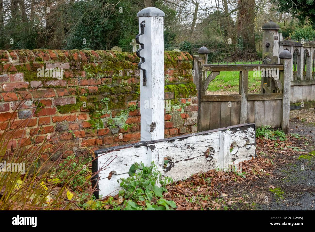 White painted stocks and whipping post on the Ufford Heritage Trail, Suffolk, UK Stock Photo