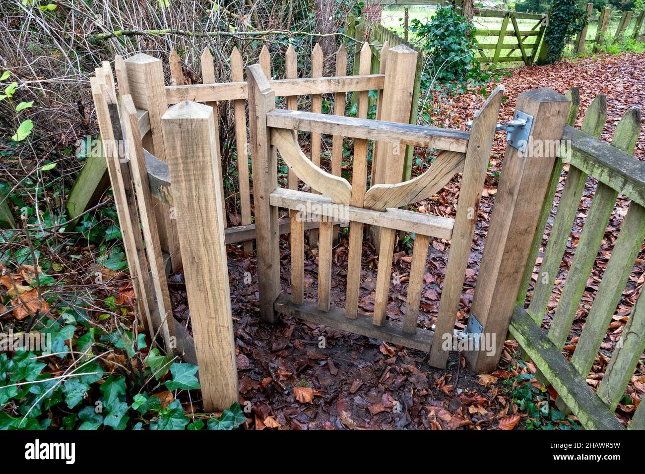 Hand built timber kissing gate complex across a public footpath ...