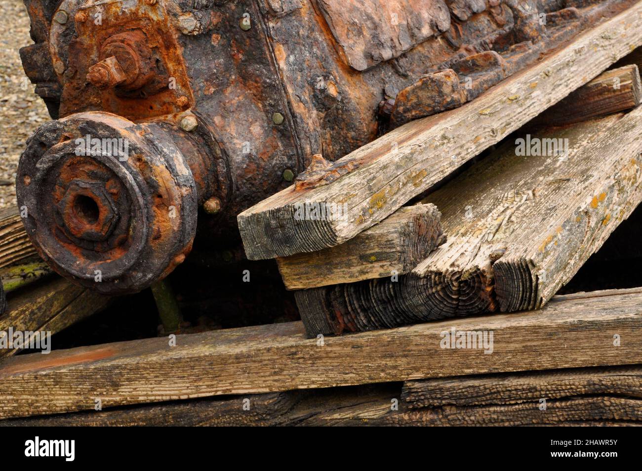 Close up of the remains of a wrecked wooden boat's engine and mounting in the hull on the foreshore in the tidal estuary of the river Hayle nr St.Ives Stock Photo