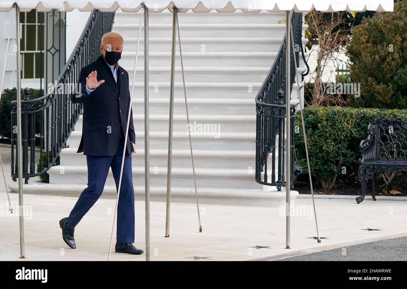 washington, DC, US, 15/12/2021, United States President Joe Biden waves to the media as he walks toward Marine One en route to Joint Base Andrews where he will depart to Fort Campbell, Kentucky and then on to Mayfield and Dawson Springs, Kentucky to survey storm damage following extreme weather events at the White House in Washington, DC on Wednesday, December 15, 2021. A series of storms hit states across the Midwest and the South leaving entire communities in Kentucky destroyed. Credit: Leigh Vogel/Pool via CNP /MediaPunch Stock Photo
