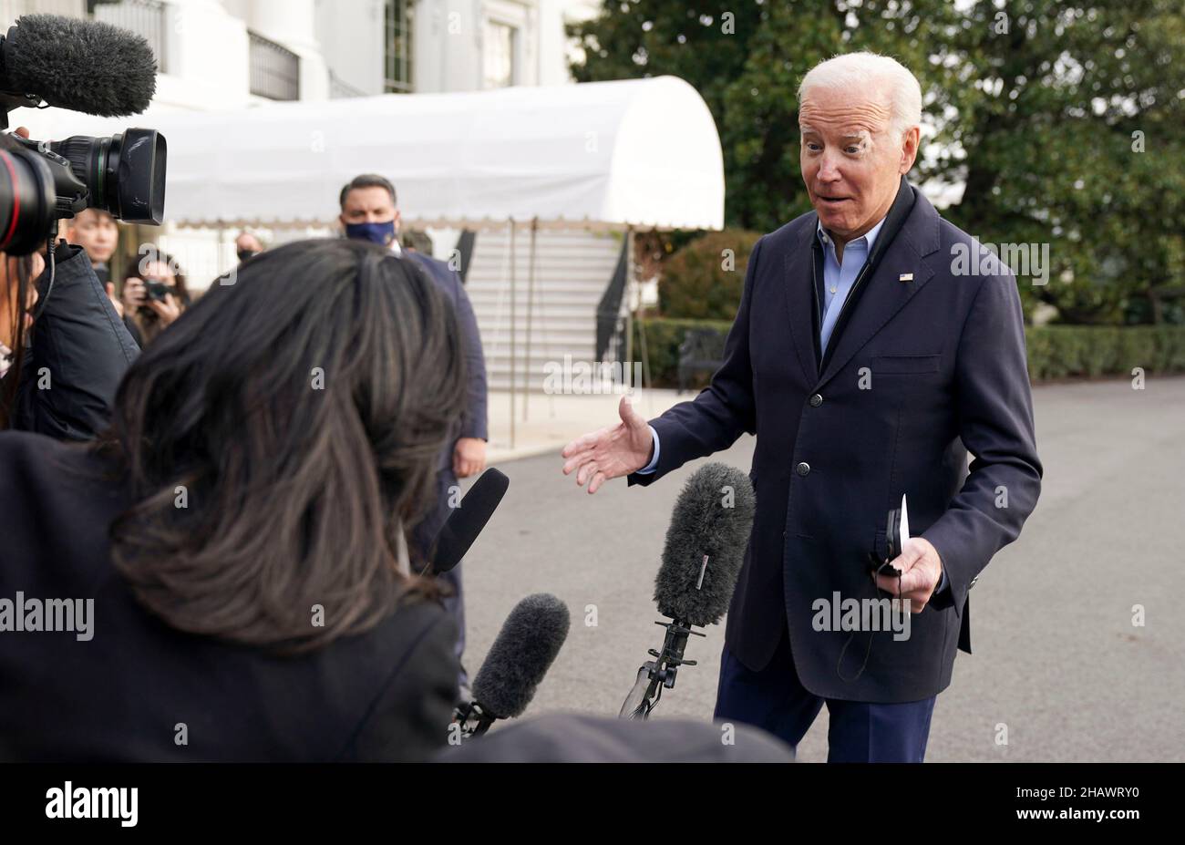 washington, DC, US, 15/12/2021, United States President Joe Biden speaks to media as he walks toward Marine One en route to Joint Base Andrews where he will depart to Fort Campbell, Kentucky and then on to Mayfield and Dawson Springs, Kentucky to survey storm damage following extreme weather events at the White House in Washington, DC on Wednesday, December 15, 2021. A series of storms hit states across the Midwest and the South leaving entire communities in Kentucky destroyed. Credit: Leigh Vogel/Pool via CNP /MediaPunch Stock Photo