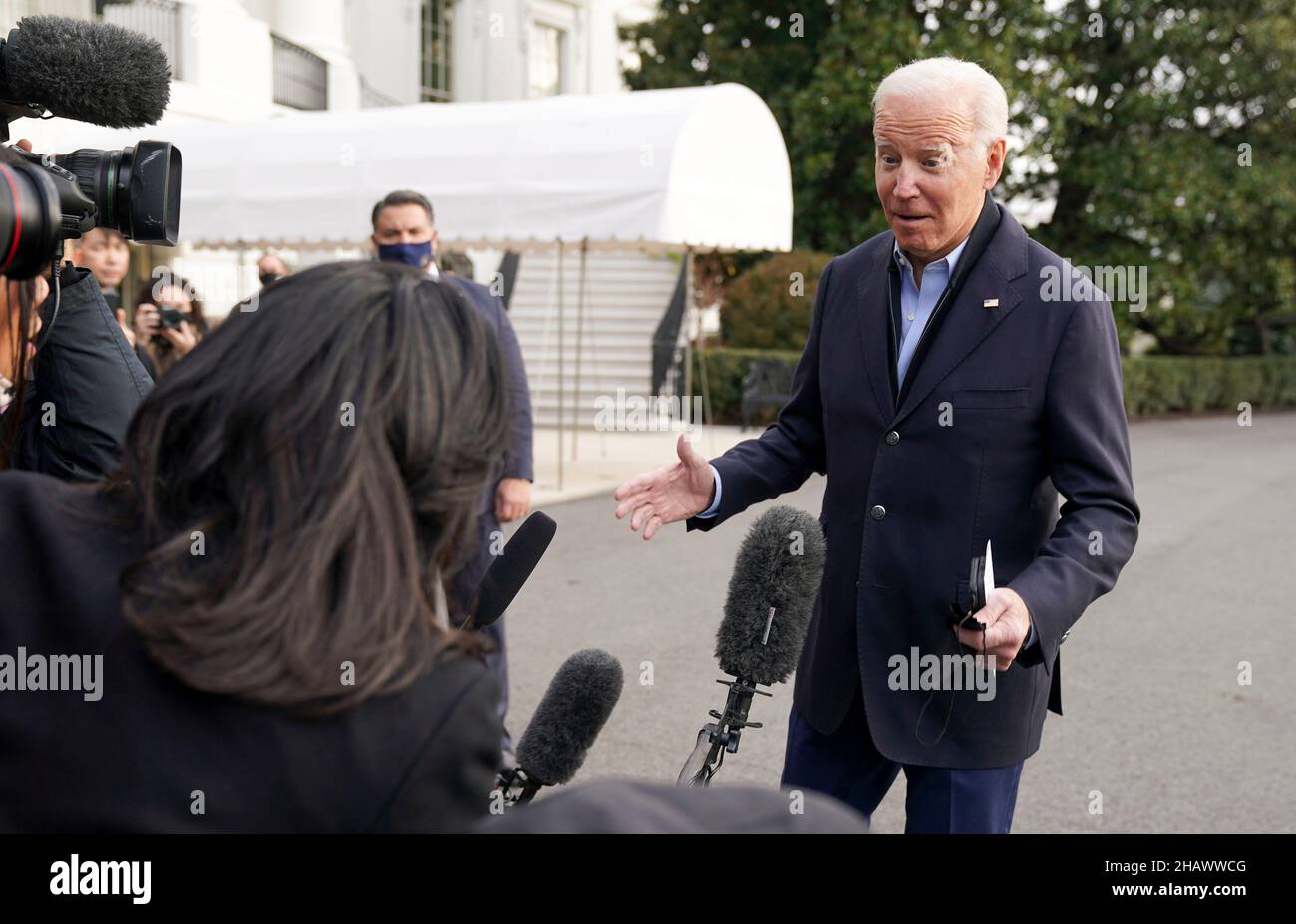 United States President Joe Biden speaks to media as he walks toward Marine One en route to Joint Base Andrews where he will depart to Fort Campbell, Kentucky and then on to Mayfield and Dawson Springs, Kentucky to survey storm damage following extreme weather events at the White House in Washington, DC on Wednesday, December 15, 2021. A series of storms hit states across the Midwest and the South leaving entire communities in Kentucky destroyed. Credit: Leigh Vogel/Pool via CNP Stock Photo