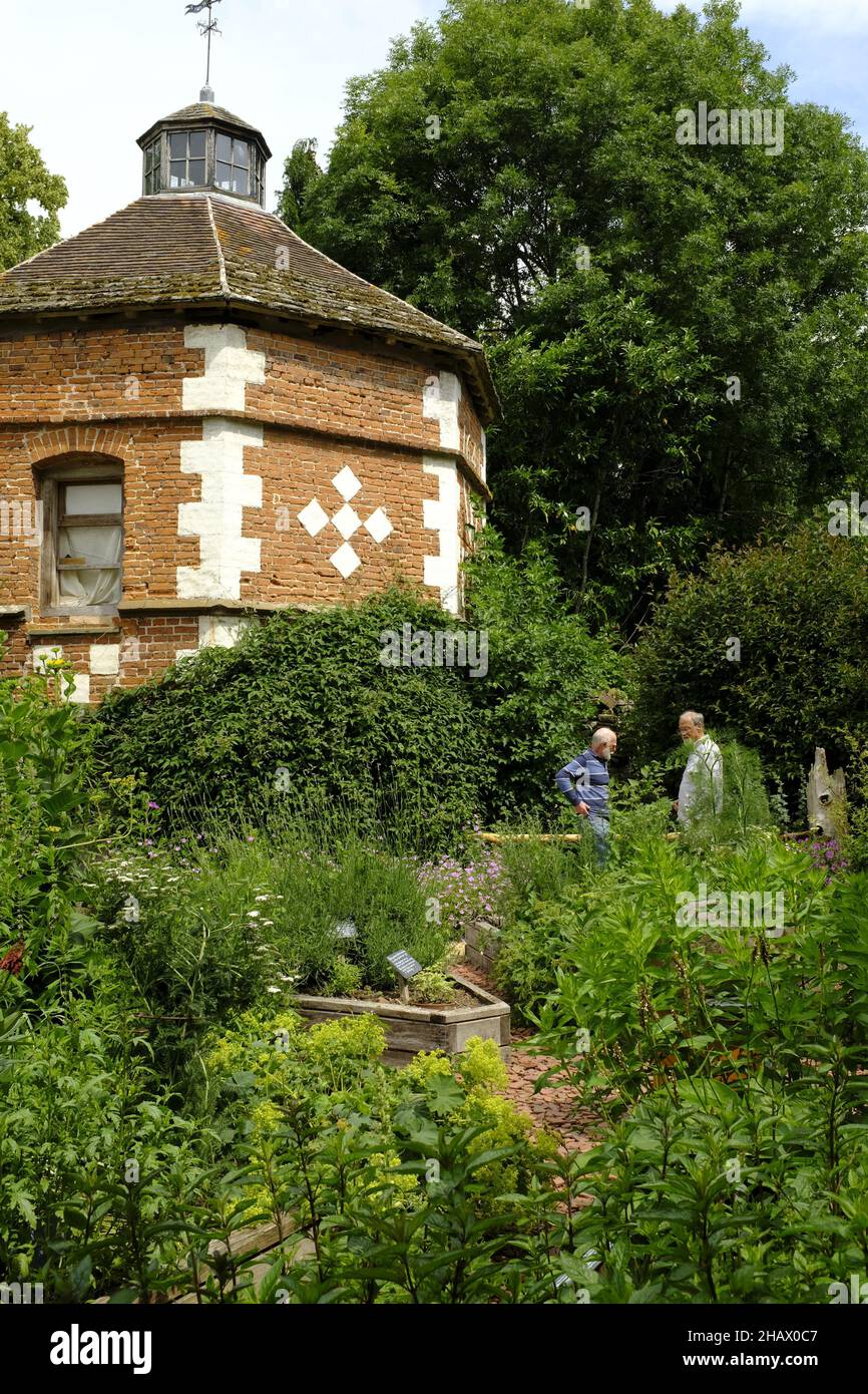 Visitors at the octagonal dovecote, dated 1641, in the gardens of Hellens Manor, Much Markle, Herts, UK Stock Photo