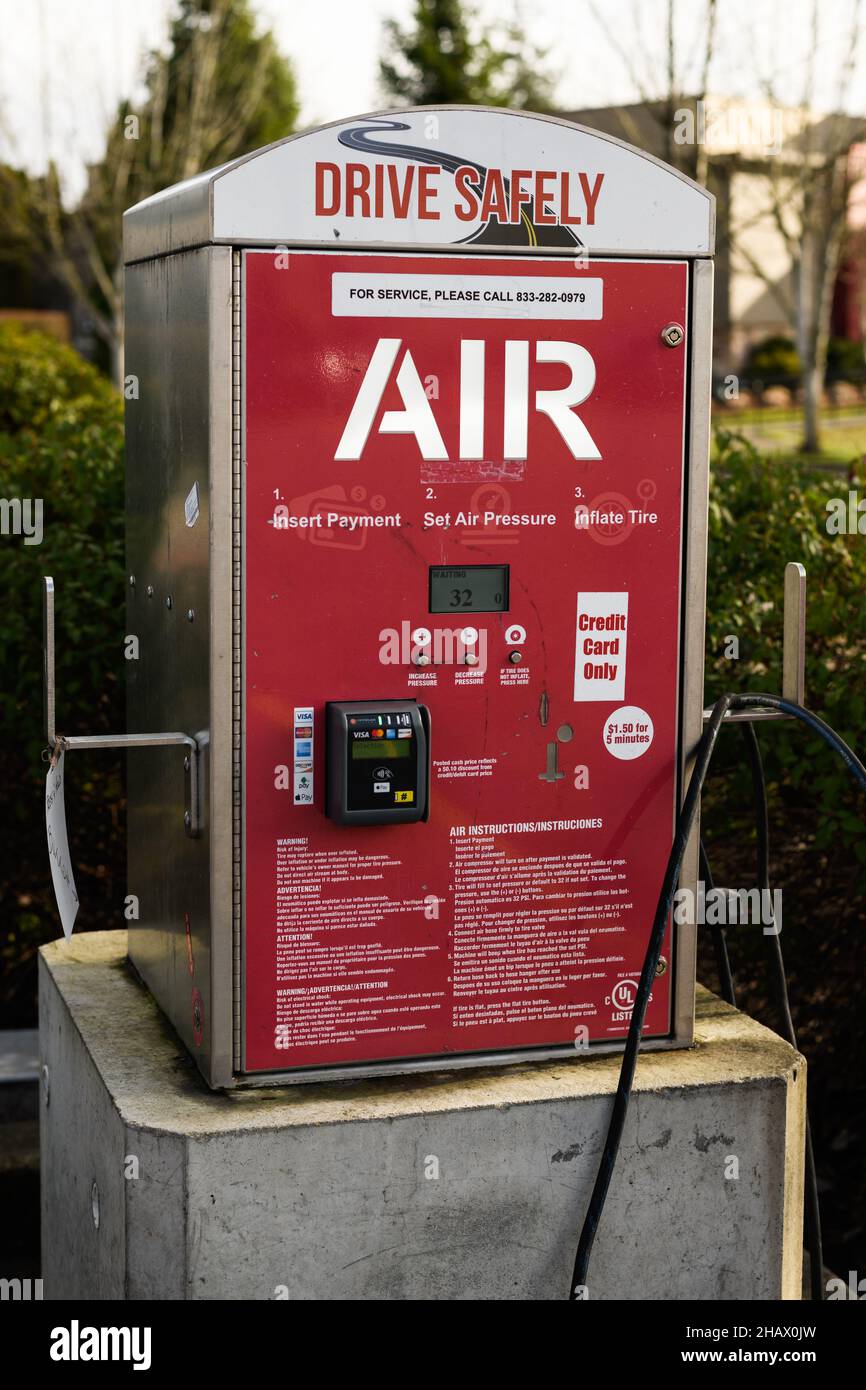 Monroe, WA, USA - December 14, 2021; Air compressor at gas station .  The red and white machine has the payment option of credit card only Stock Photo