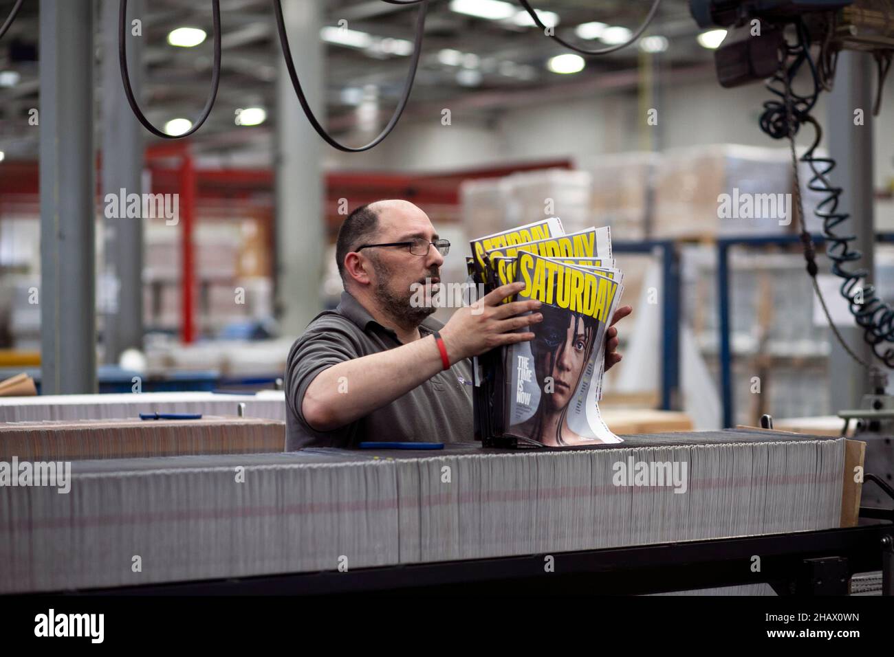 James King (Lead Bindery Assistant) begins the binding process of ‘loading’ onto the machines