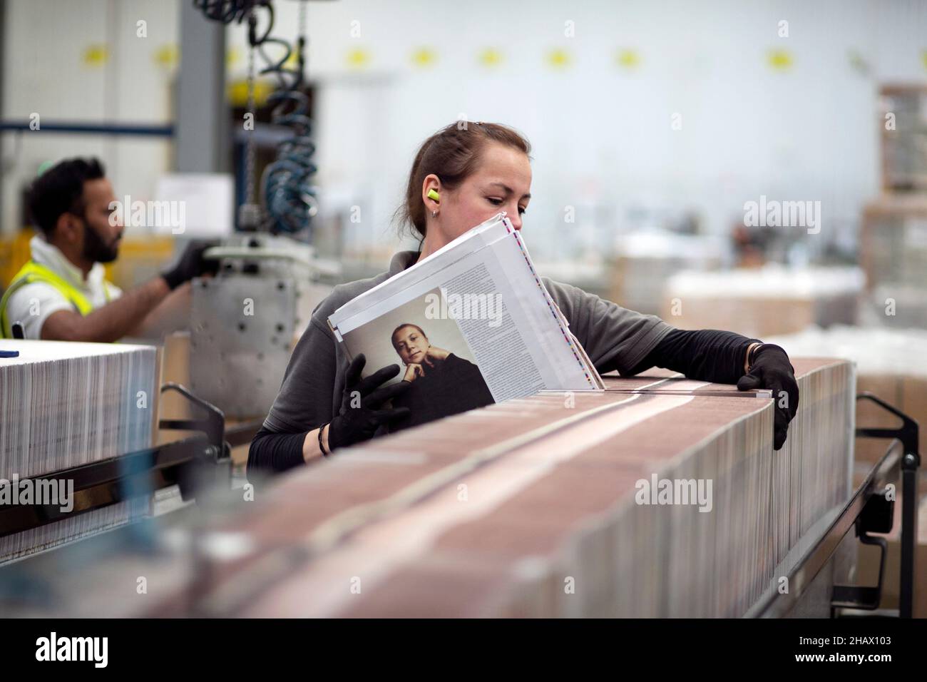 Karazyne Ochab (Lead Bindery Assistant) begins the binding process of ‘loading’ onto the