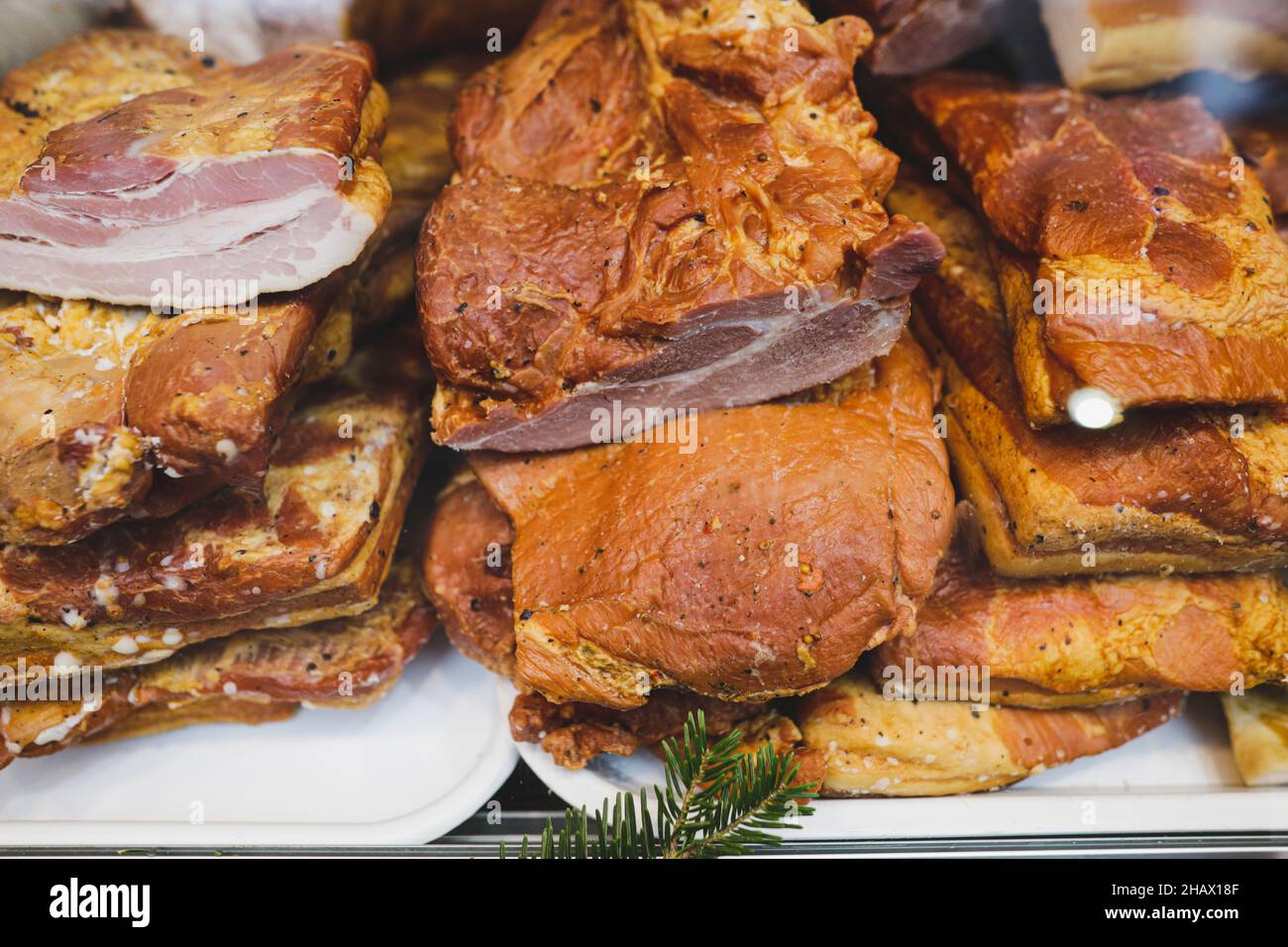 Shallow depth of field (selective focus) image with traditional Romanian winter holidays meat foods for sale in an outdoors market in Bucharest, Roman Stock Photo